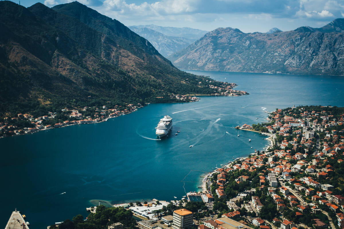 Aerial View of Kotor bay. Cruise ship docked in beautiful summer day.