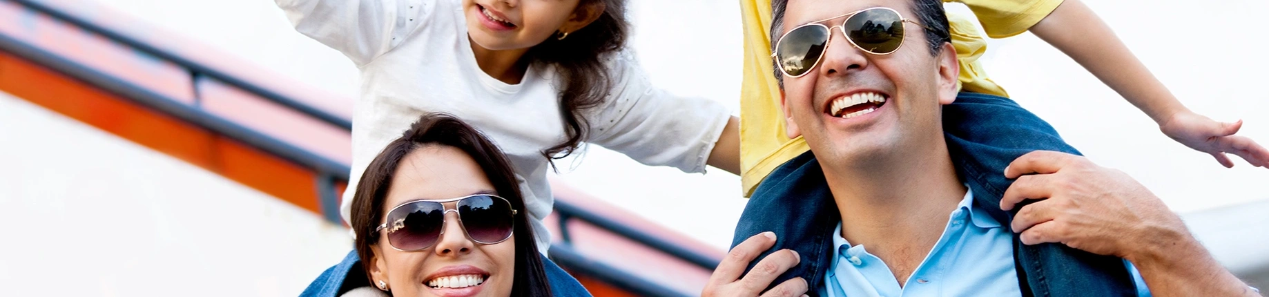 Family smiling and enjoying their cruise holiday